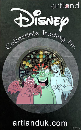A collectible trading pin featuring the three gargoyles from the Disney movie 'The Hunchback of Notre Dame', with a stained glass window design in the background.